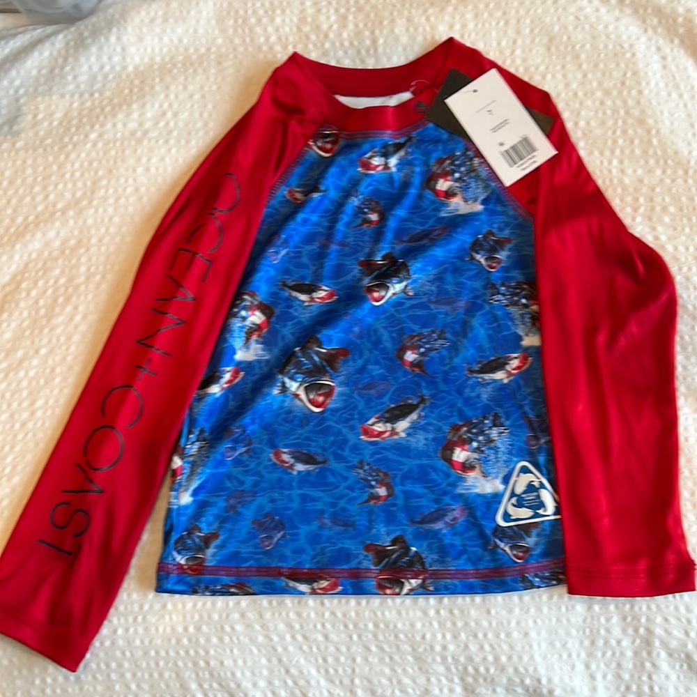 Ocean Coast red white and blue shark rash guard